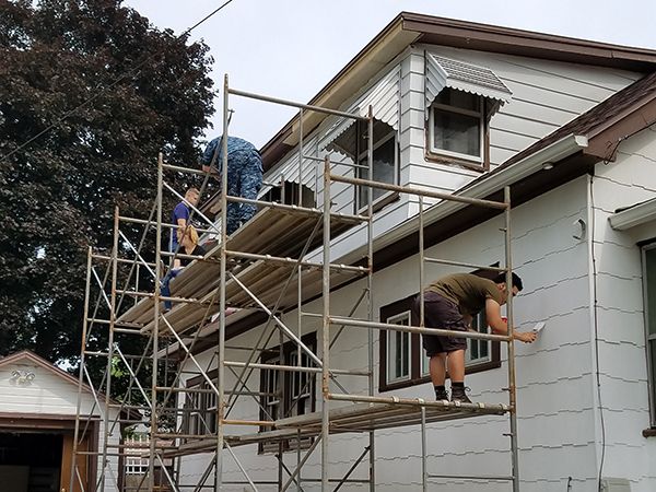 Habitat for Humanity volunteers paint a senior's home.