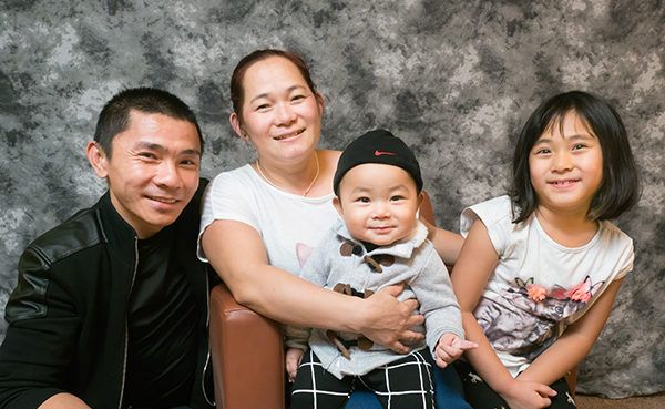 Tara Man and her family on the day they closed on their new Habitat for Humanity home.